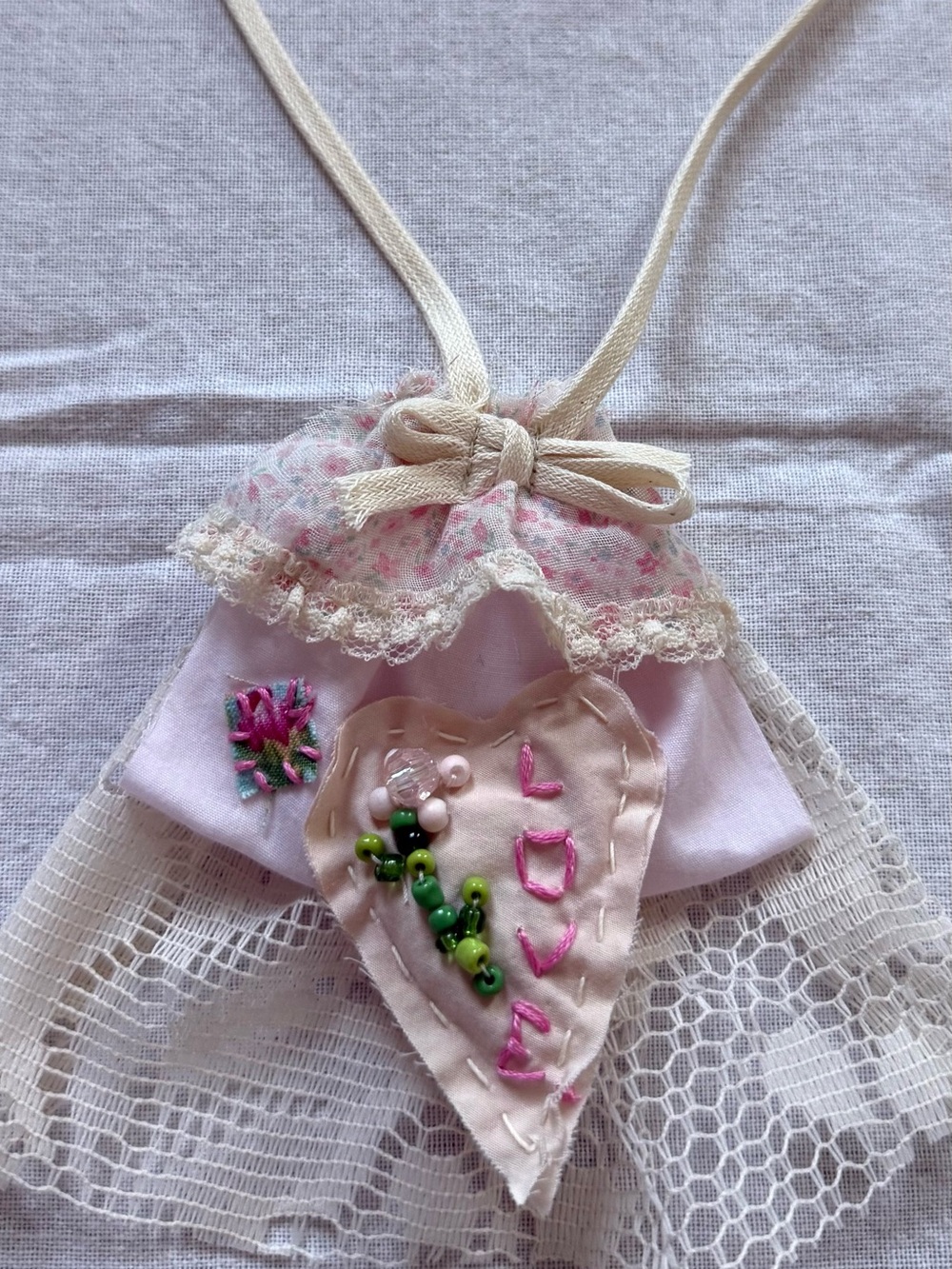 Love heart necklace with lace and bow